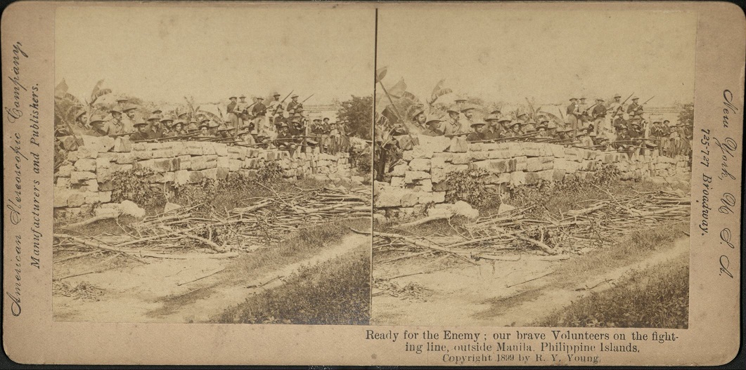 Ready for the Enemy: our brave Volunteers on the fighting line, outside Manila. Philippine Islands.